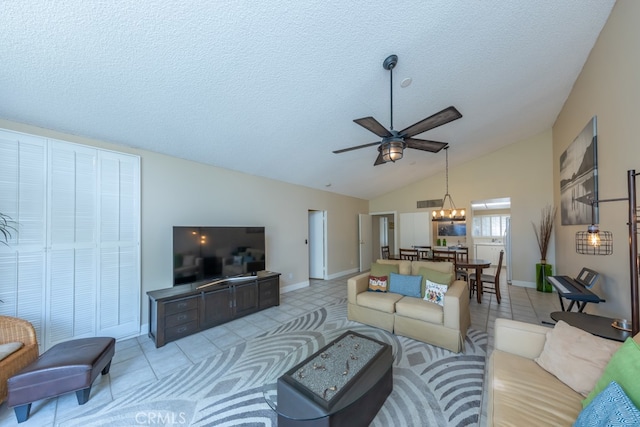 living area featuring a textured ceiling, high vaulted ceiling, light tile patterned floors, ceiling fan with notable chandelier, and baseboards