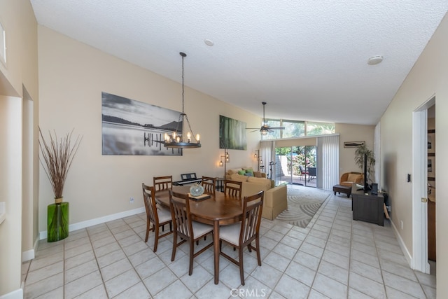 dining room with light tile patterned floors, a textured ceiling, and lofted ceiling