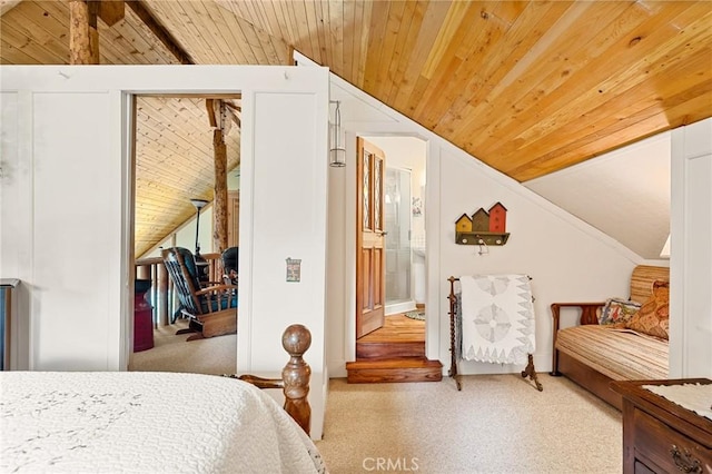 carpeted bedroom featuring vaulted ceiling and wooden ceiling