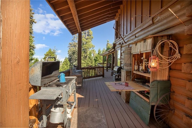 wooden deck featuring area for grilling