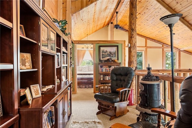 sitting room with vaulted ceiling with beams, a wealth of natural light, light carpet, and wooden ceiling