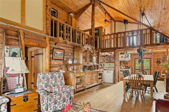 dining area with wood ceiling, vaulted ceiling with beams, and light wood-type flooring