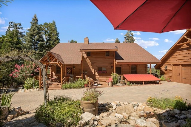 back of house featuring a patio