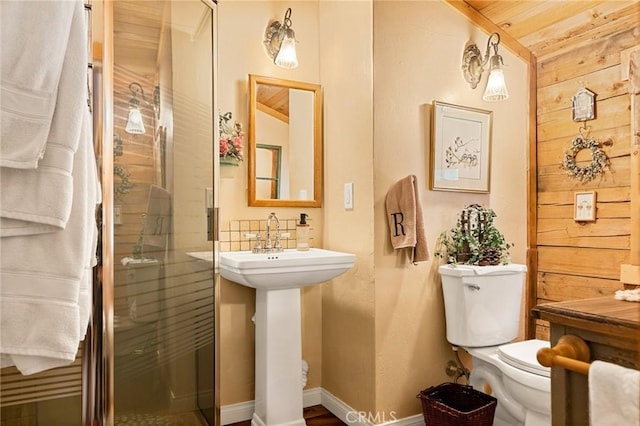 bathroom featuring toilet and walk in shower