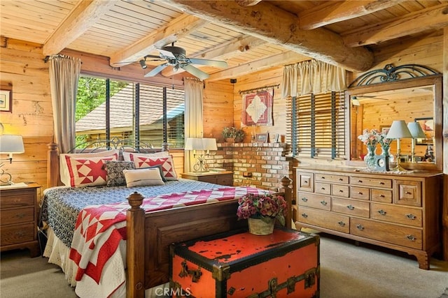 bedroom with wood ceiling, carpet, and wood walls