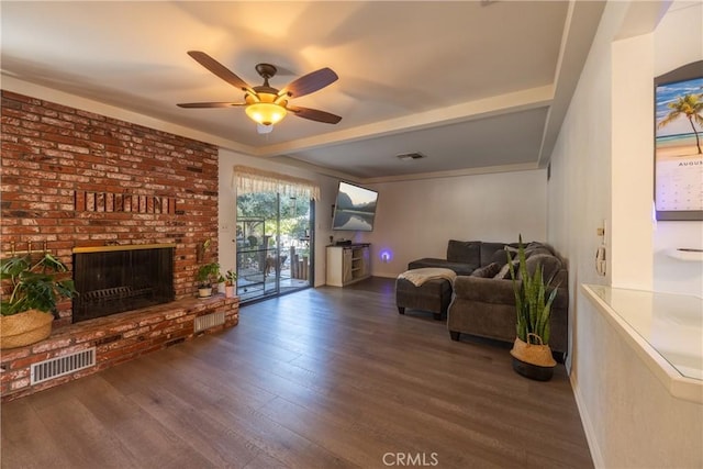 living room featuring dark wood-type flooring, ceiling fan, and a fireplace