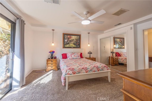 bedroom with ceiling fan, a closet, and carpet flooring