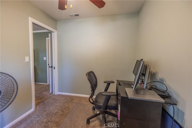 carpeted office featuring ceiling fan