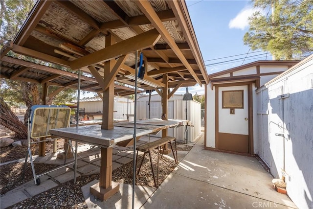 view of patio / terrace with a shed