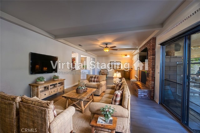 living room with ceiling fan, hardwood / wood-style flooring, a brick fireplace, and beamed ceiling