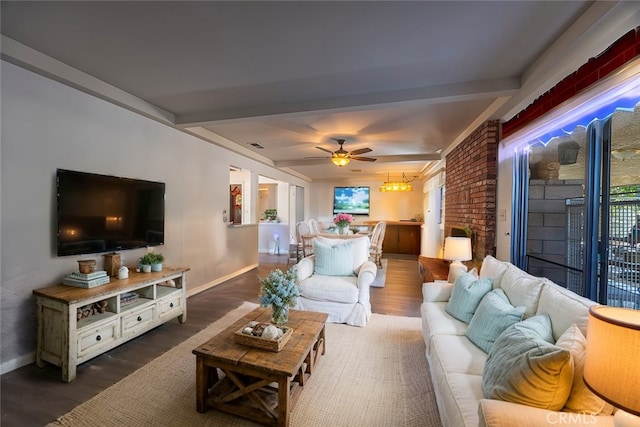 living room with ceiling fan, dark hardwood / wood-style flooring, and beamed ceiling