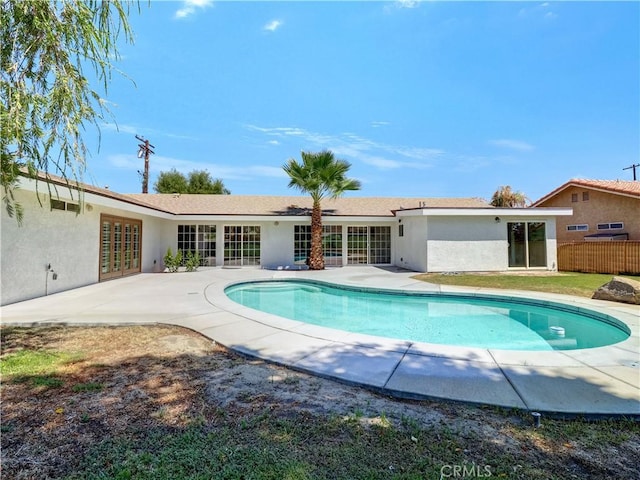 view of pool featuring french doors and a patio