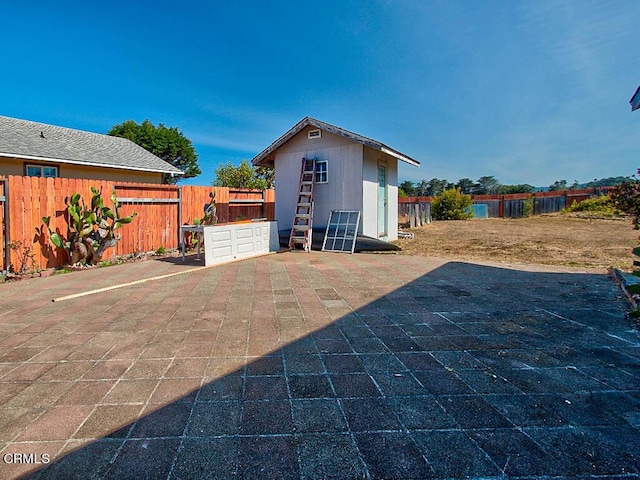 view of patio featuring an outdoor structure