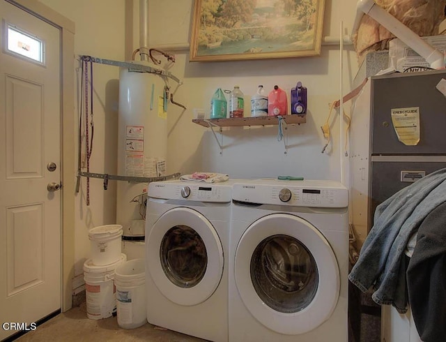 washroom with washing machine and dryer and secured water heater