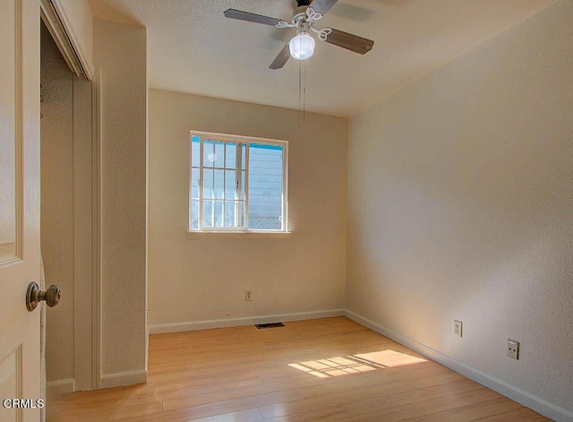 unfurnished room featuring ceiling fan and light hardwood / wood-style floors