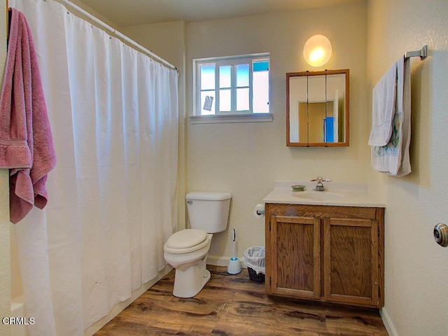 bathroom featuring vanity, a shower with curtain, wood-type flooring, and toilet