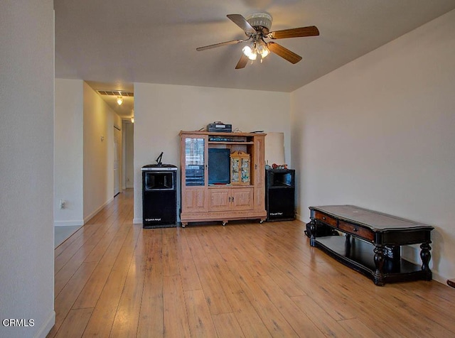 interior space with light hardwood / wood-style flooring and ceiling fan