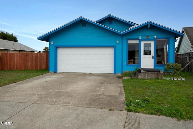 view of front of house with a garage and a front yard