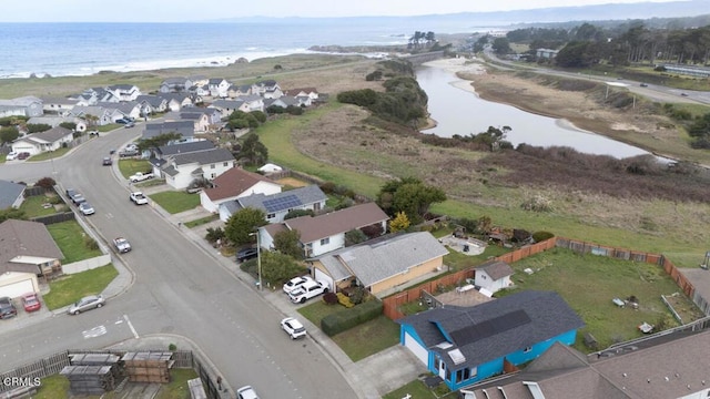 bird's eye view featuring a residential view and a water view