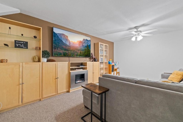 living room featuring ceiling fan and light colored carpet