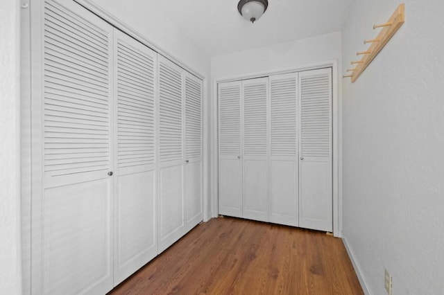 corridor featuring hardwood / wood-style flooring