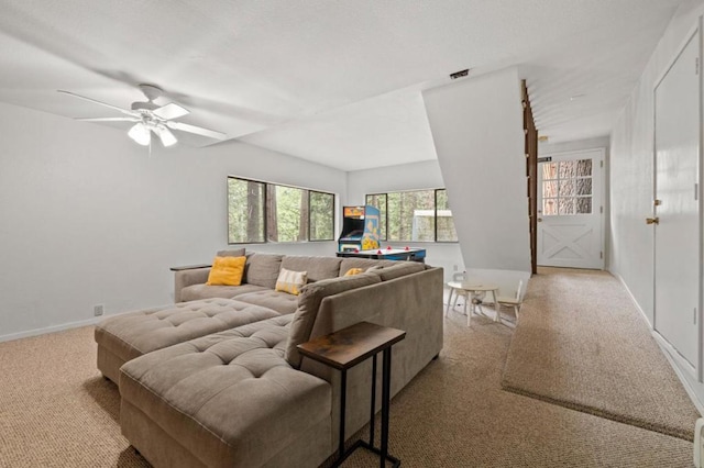 living room with pool table, ceiling fan, and light colored carpet