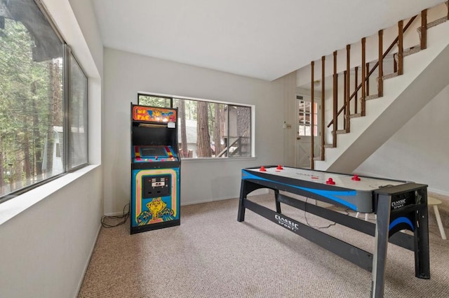 recreation room with carpet flooring