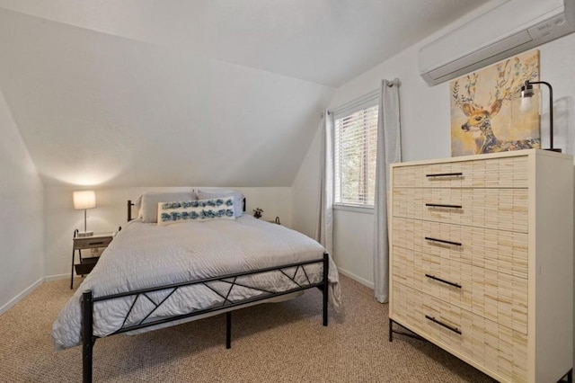 bedroom featuring carpet flooring, vaulted ceiling, and a wall unit AC