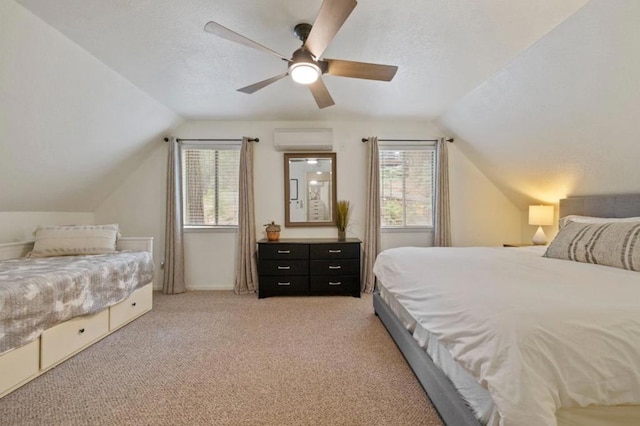 carpeted bedroom featuring vaulted ceiling, multiple windows, and ceiling fan