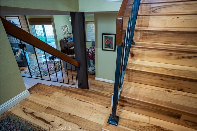 stairway featuring hardwood / wood-style flooring