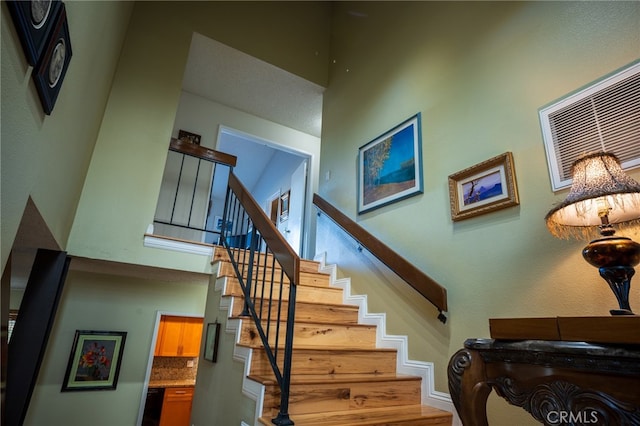 staircase featuring hardwood / wood-style floors