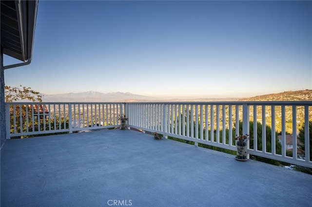 balcony at dusk with a mountain view