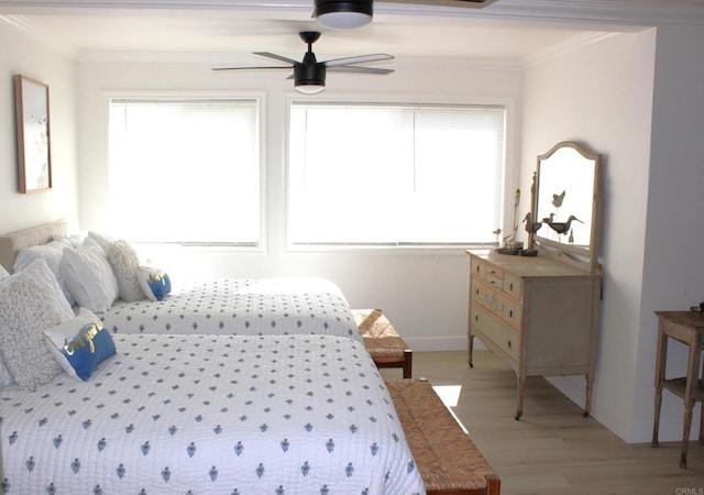 bedroom with multiple windows, ceiling fan, and crown molding