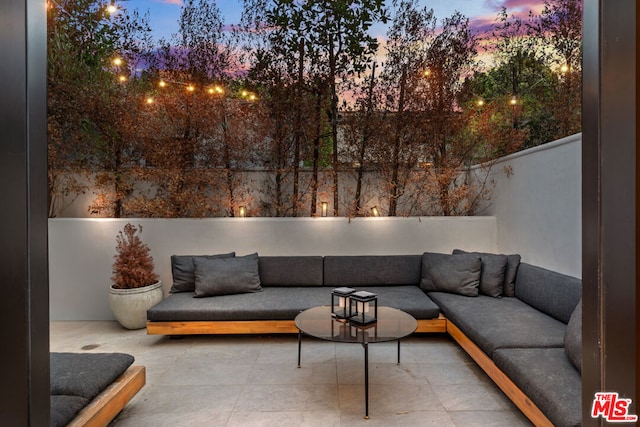 patio terrace at dusk with an outdoor hangout area