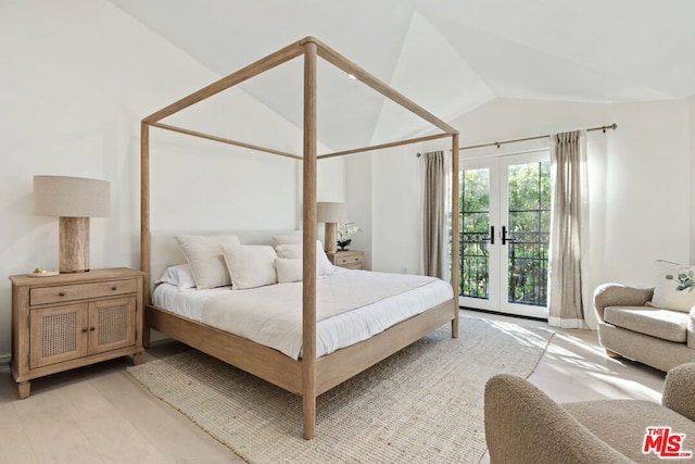 bedroom with light hardwood / wood-style floors, french doors, vaulted ceiling, and access to exterior