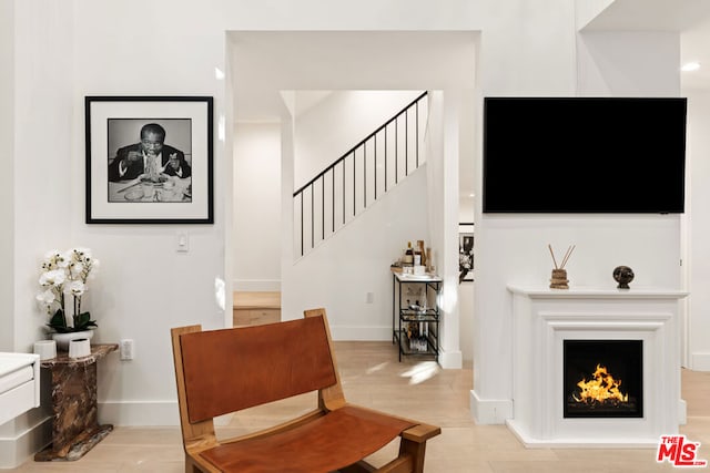 sitting room featuring light hardwood / wood-style flooring