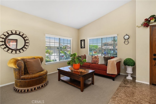 living area with lofted ceiling, carpet, and baseboards