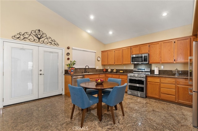 kitchen with dark countertops, recessed lighting, stainless steel appliances, and french doors