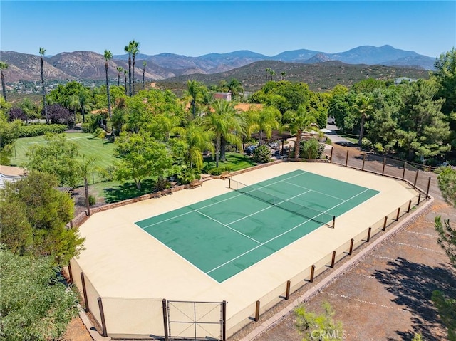 exterior space featuring a mountain view and basketball court