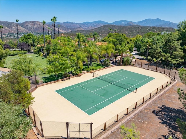 view of sport court with a mountain view and basketball court