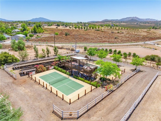 birds eye view of property with a mountain view