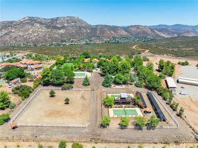 birds eye view of property with a mountain view