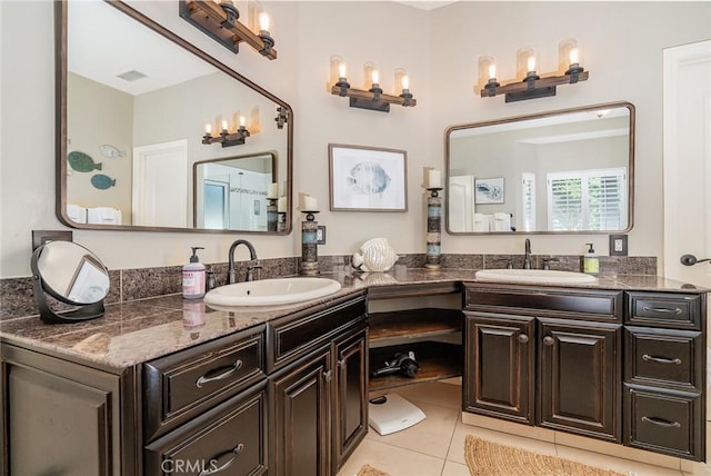 bathroom with tile patterned floors and vanity