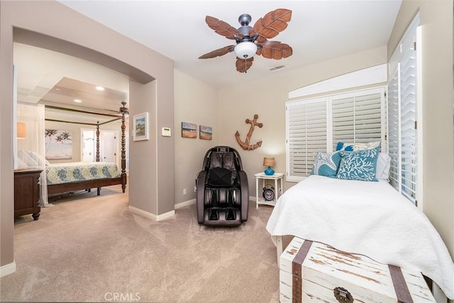 bedroom with ceiling fan and light colored carpet