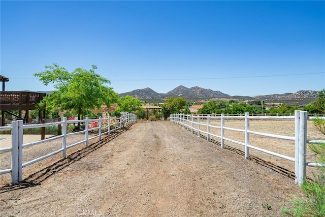 view of street with a mountain view and a rural view