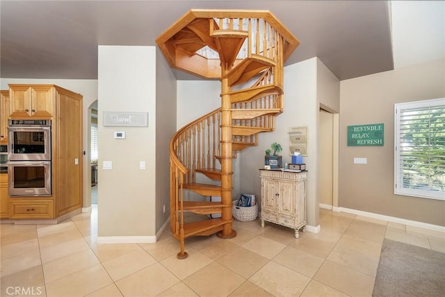 stairs with tile patterned flooring