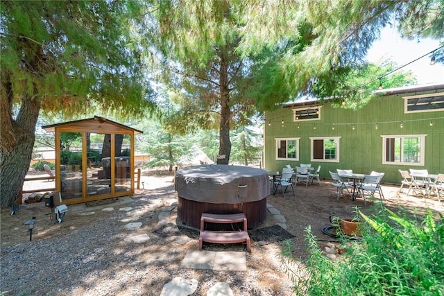 view of patio / terrace featuring a hot tub