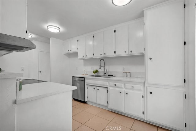 kitchen featuring white cabinets, stainless steel dishwasher, sink, and light tile patterned floors