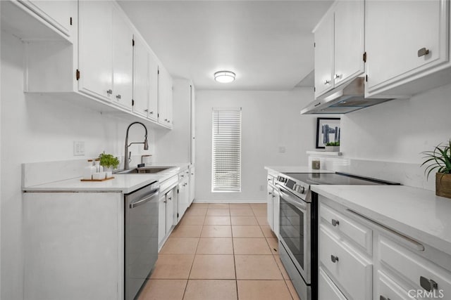 kitchen with white cabinetry, light tile patterned floors, appliances with stainless steel finishes, and sink