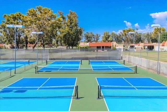 view of tennis court featuring basketball court